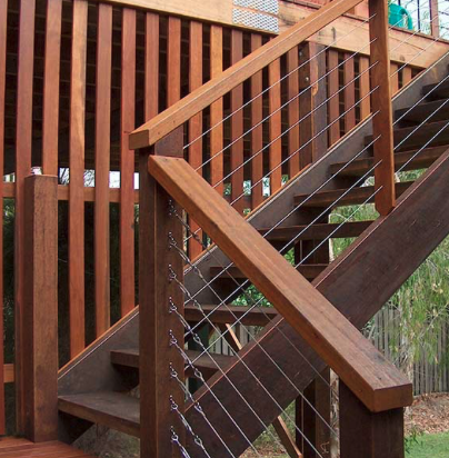 Stained hardwood stairs with cable railing in Naperville